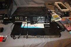 Daewoo VHS Player, Arris HDMI Box, Sony Blu Ray Player, VHS Player, TV Remotes, Candles, Kinyo VHS Tape Player, Protron DVD Player, Iron, and Misc.
