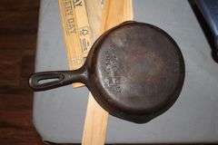 6.5 Inch Number 3 Cast Iron Skillet, Calphalon Skillet, (2) Coffee Makers, Strainers, Pots with Lids, and Misc.