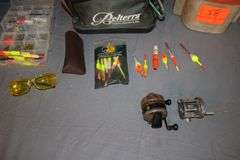 (2) Minnow Buckets, Zebco Omega Reel, PFlueger Reel, Ear Muffs, Bobbers, and Misc. Fishing Tackle