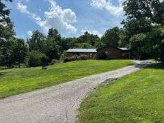 PARCEL 1: LOG HOME - BASEMENT - GARAGE - 1.2 ACRES: 487 Quiggins Lane, Leitchfield, KY 42754
