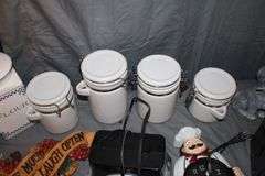 (4) Canisters with Sealing Lids, (4) Decorative Canisters, Wolf Statue, Alarm Clock, Wall Decorations, Tape Cleaner, and Misc.