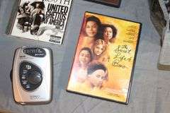 DVD Cases, Belmont Binoculars, Kodak Record Player, DVD Player, Clock Radio, Headphones, Camera Bag, and Misc.