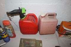 (2) Gas Cans, Yard Stick, Pliers, Screwdrivers, Hand Saw, Chicago Electric Jigsaw, Caulk Gun, and Misc.