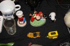 Easy Stitch Sewing Machine, Seamstress Garmet Steam Iron, Wall Decorations, (2) Electric Irons, License Plate, Peanuts Figurines, and Misc.