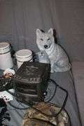 (4) Canisters with Sealing Lids, (4) Decorative Canisters, Wolf Statue, Alarm Clock, Wall Decorations, Tape Cleaner, and Misc.