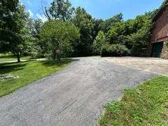 PARCEL 1: LOG HOME - BASEMENT - GARAGE - 1.2 ACRES: 487 Quiggins Lane, Leitchfield, KY 42754