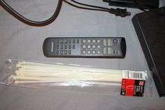 Daewoo VHS Player, Arris HDMI Box, Sony Blu Ray Player, VHS Player, TV Remotes, Candles, Kinyo VHS Tape Player, Protron DVD Player, Iron, and Misc.