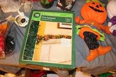Christmas Wrapping Paper, Rubbermaid Slimfit Wheeled Underbed Box, Stuffed Snoopy, Santa Figurine, Stuffed Decorations, Gift Bags, Holiday Bowls, Angel Figurines, and Misc. Decorations