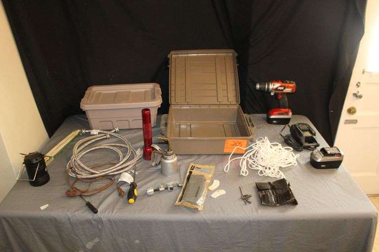 18 V Skil Drill with (2) Batteries and Charger, (2) 6 Ft Stainless Hoses, Lantern, Sterilite Plastic Box, Ammo Crate, Pistol Grips, 30 Round PMag, Pipe Cutter, Oil Can, and Misc. image