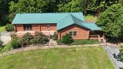 PARCEL 1: LOG HOME - BASEMENT - GARAGE - 1.2 ACRES: 487 Quiggins Lane, Leitchfield, KY 42754