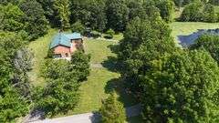 PARCEL 1: LOG HOME - BASEMENT - GARAGE - 1.2 ACRES: 487 Quiggins Lane, Leitchfield, KY 42754