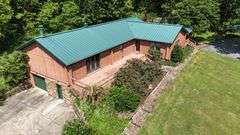 PARCEL 1: LOG HOME - BASEMENT - GARAGE - 1.2 ACRES: 487 Quiggins Lane, Leitchfield, KY 42754