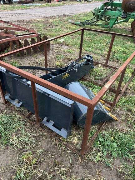 Skid steer quick attach back hoe with 20" bucket, owner states new, row:3