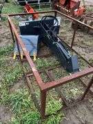 Skid steer quick attach back hoe with 20" bucket, owner states new, row:3