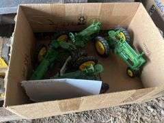 (4) John Deere toy tractors, bldg:locked