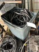 Lot of weather stripping (various sizes) in a trash can, bldg:Green