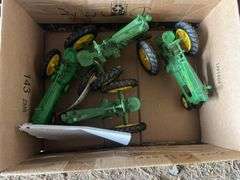 (4) John Deere toy tractors, bldg:locked