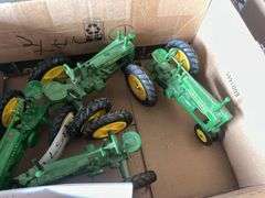 (4) John Deere toy tractors, bldg:locked