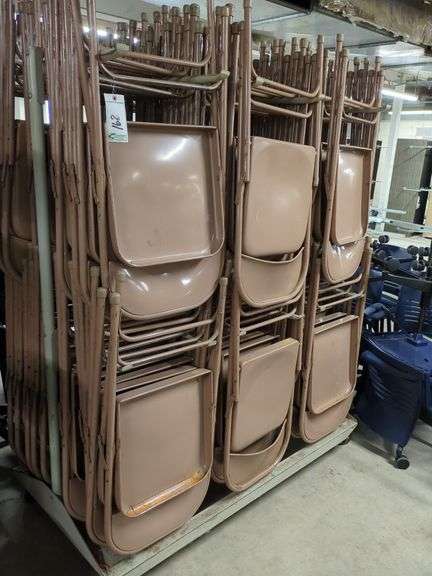 Folding Chairs on Rack image