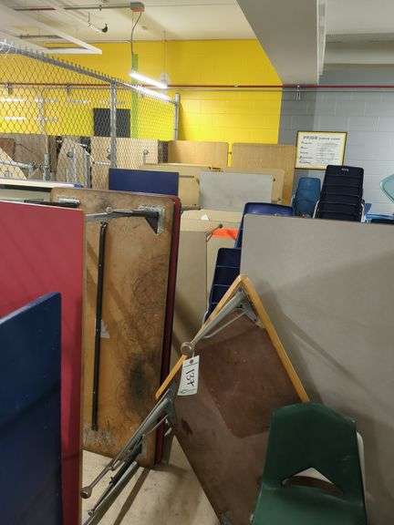 Contents of cage, chairs, desks, tables and wooden shelves in back)