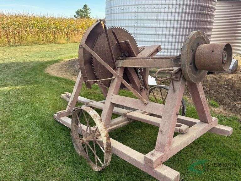 Vintage Buzz saw on steel wheel trailer, belt drive image