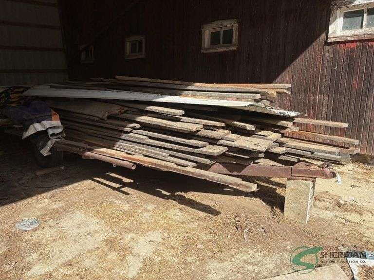 Single axle trailer full of rough sawn cherry and some barn siding image
