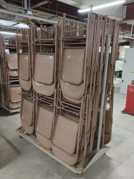 Metal Folding Chairs on Rack image