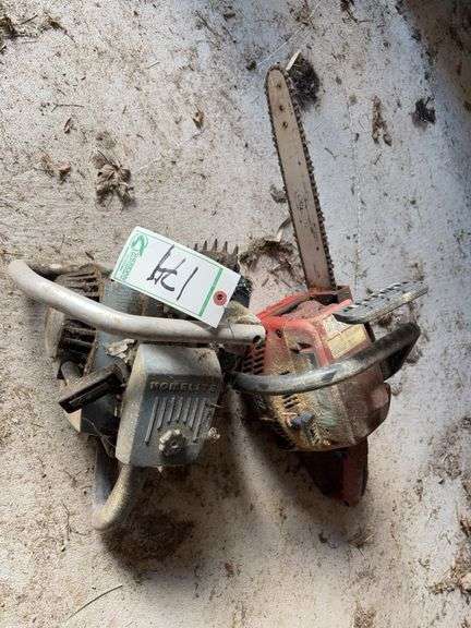 Pair of gas chain saws image