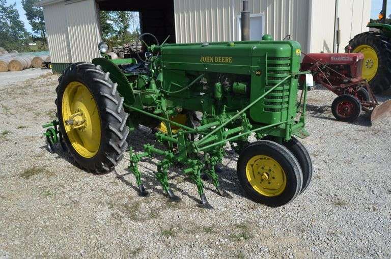 John Deere MT with cultivator and 2 bottom plow image
