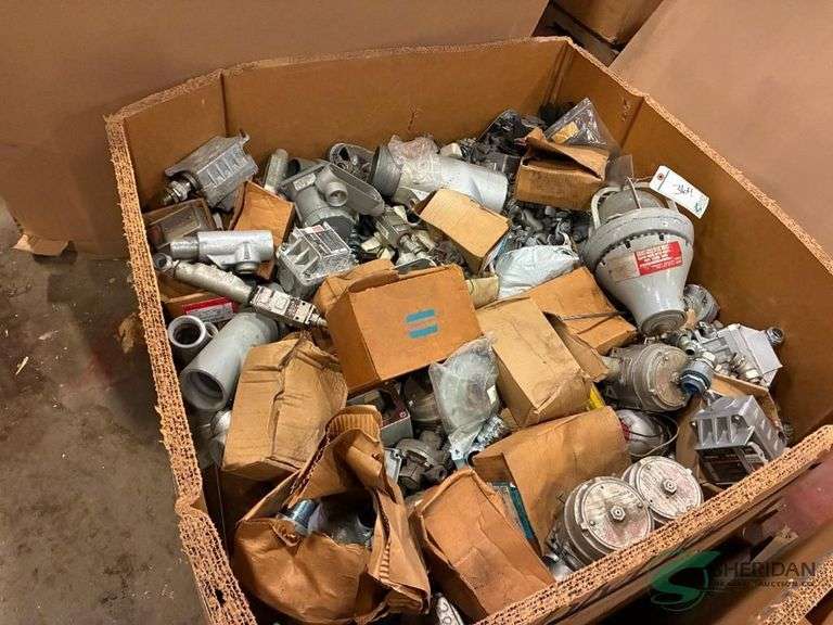 Box with numerous electrical fittings and parts image