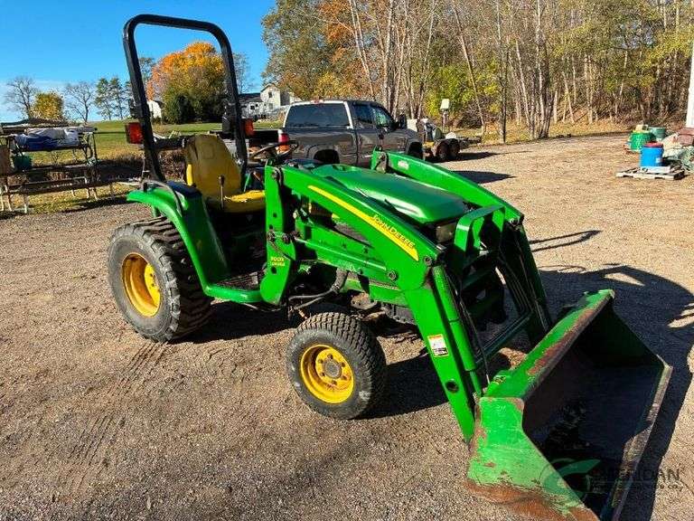 John Deere 4210 with loader and hitch attachment on rear image