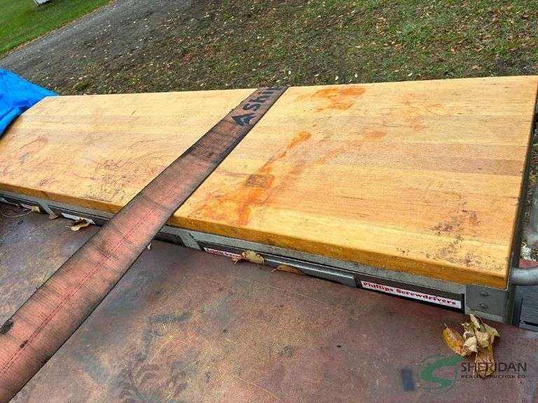 Wood topped work cabinet and contents image