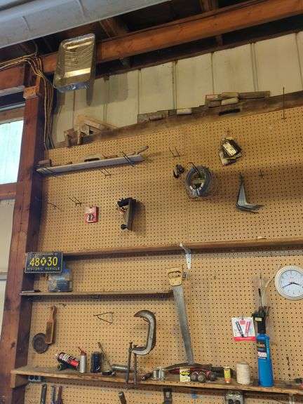 Tools Hanging Above Bench (top 2 shelves)