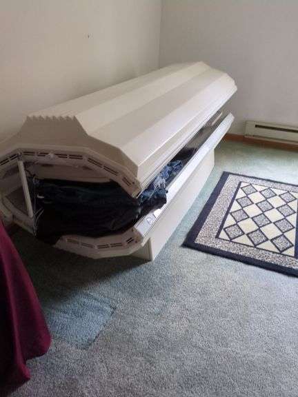 Tanning bed - Located upstairs. Buyer must bring help and responsible for removing