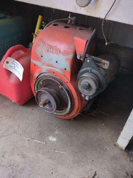Vintage Kohler gas engine and 2 fuel cans