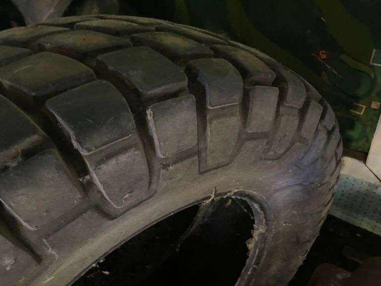 2 Loaded tires on rims and one tire 14.9-24