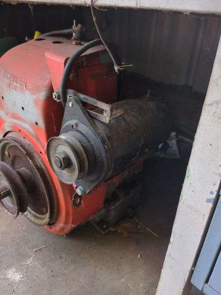 Vintage Kohler gas engine and 2 fuel cans