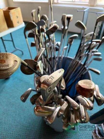 Bin of used golf clubs