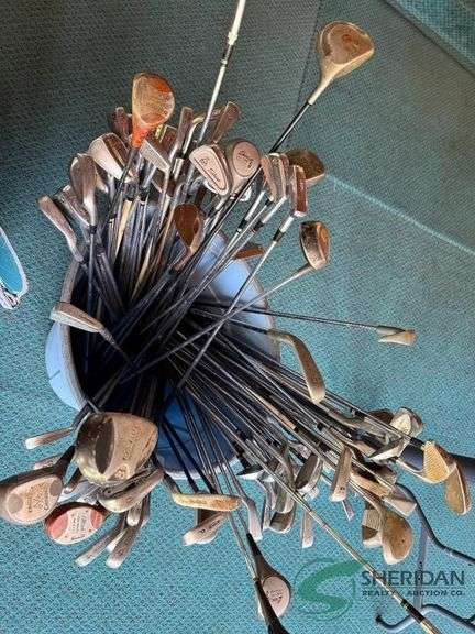 Bin of used golf clubs