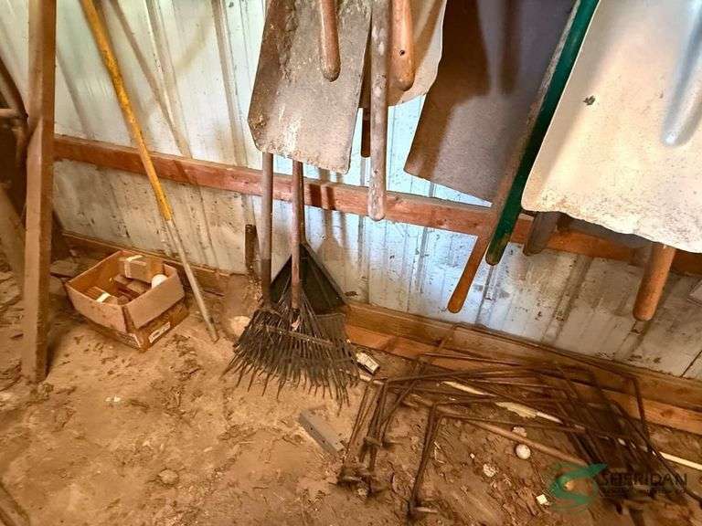 Numerous rakes and shovels