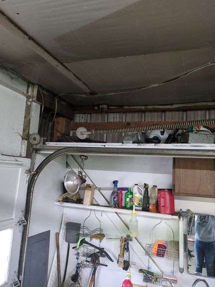 Contents of top shelf, sprayer, metal tool box