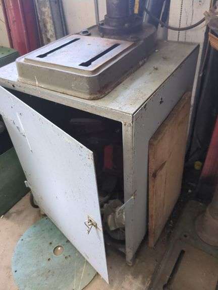 Bench model drill press includes cabinet and contents