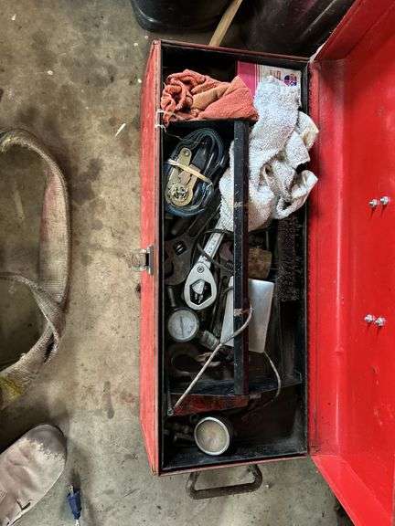 Red toolbox with miscellaneous tools
