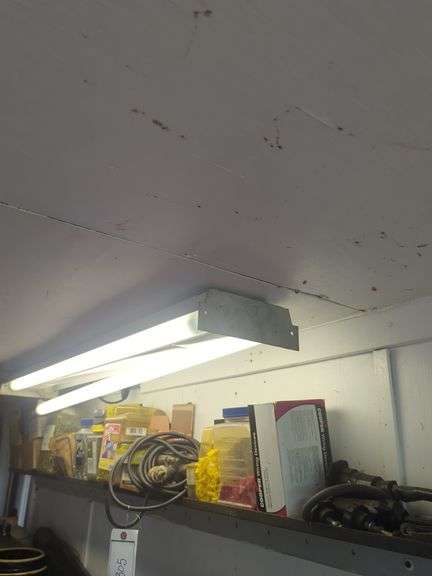Shelf of nails, caps, and hoses