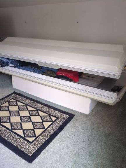 Tanning bed - Located upstairs. Buyer must bring help and responsible for removing