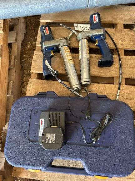 (3) Lincoln 12 Volt battery operated grease guns, bldg:locked image