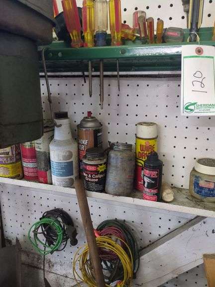 Screw drivers, contents of small shelf, hanging tools