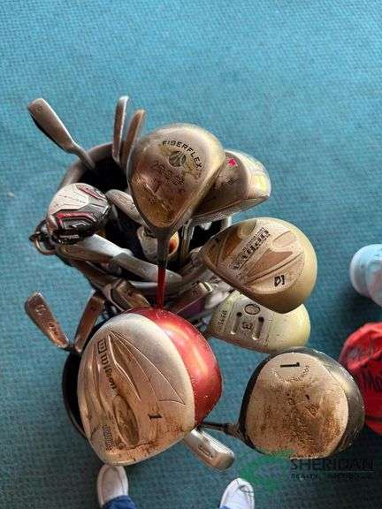 2 sets of rental clubs with bags