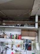 Contents of top shelf, sprayer, metal tool box