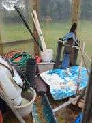 Wooden bench and contents of shed/greenhouse